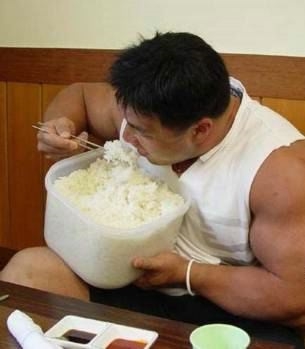 Hungry man eats rice