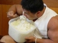 Hungry man eats rice